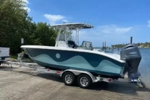 Center console boat with a custom wave graphic wrap