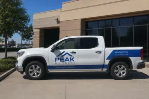 Pickup truck with builder branding wrap graphics