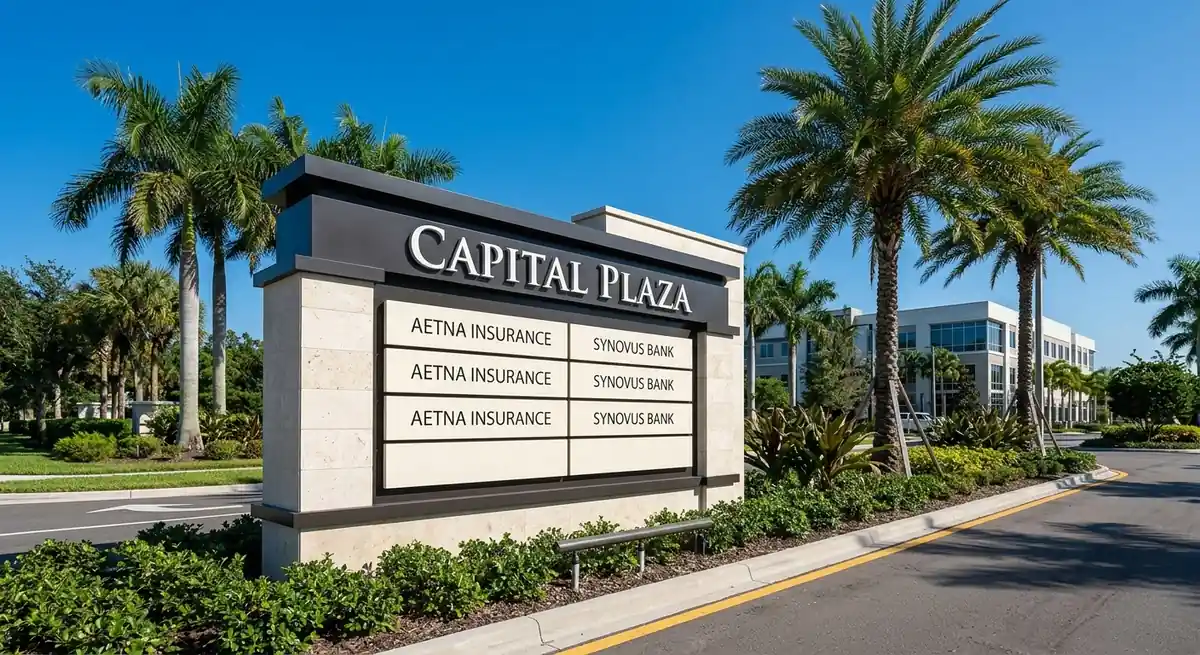 Monument sign with changeable tenant panels at an office plaza